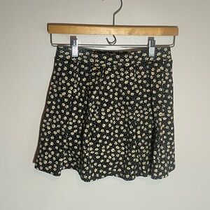 SO Black Mini Skirt with light yellow/green and red/orange Floral Pattern